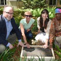 "Anson Street African Burial Ground (ASABG) members (from left) Theodore Schurr of Penn, Joanna Gilmore of ASABG and the College of Charleston, Raquel Fleskes of the University of Connecticut, and La'Sheia Oubré of ASABG at the memorial plaque at the site where the Ancestors were re-buried. (Image: Servant Emannuel Branch)"
