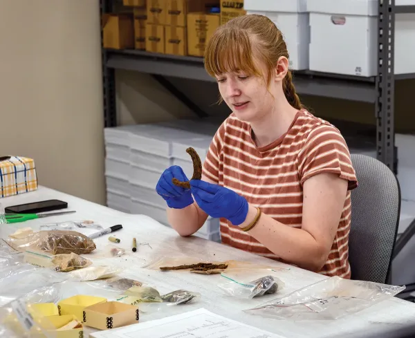 Emma Collett holds up a horseshoe